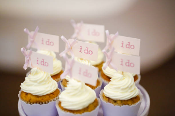 istock close up with delicious cupcakes with message I do 1143256868