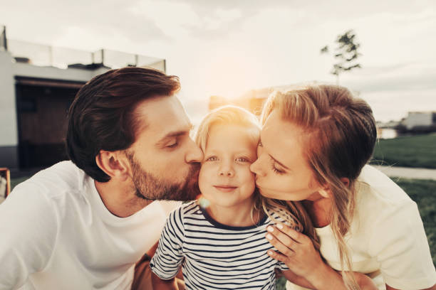 istock Friendly parents expressing love for pleased daughter 1143257026