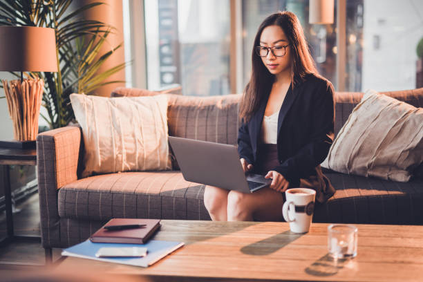 istock Beautiful businesswoman working on computer in cafe. 1143257075