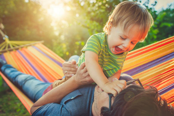 istock Family enjoying spring/summer day in hammock 1143257557