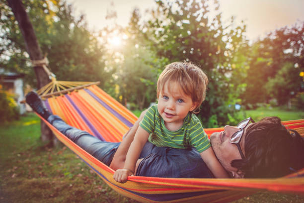 istock Family enjoying spring/summer day in hammock 1143257615