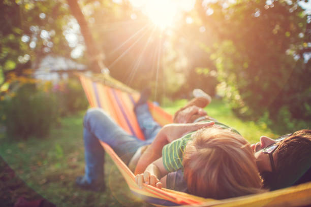 istock Family enjoying spring/summer day in hammock 1143257676