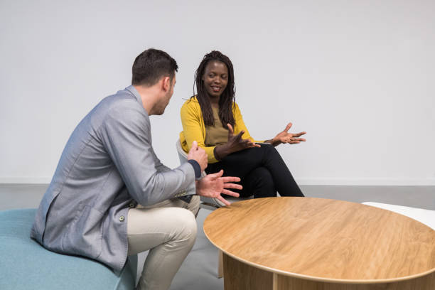 istock Two business people talking in a lobby 1143258222