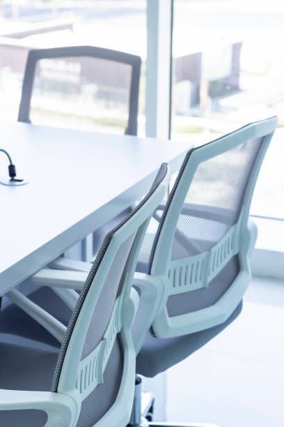 istock Three office chairs and conference table in the office. Business or office work concept. Selective focus. 1143258264