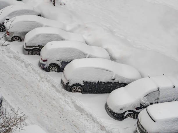 istock cars covered by snow after winter storm 1143258425