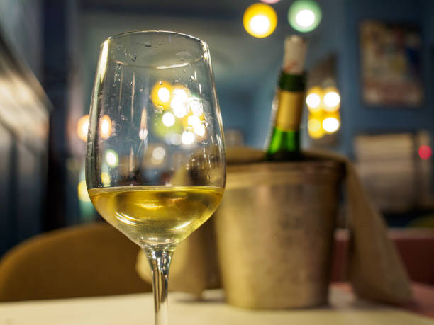 Glass of riesling white wine at restaurant, Colmar, France stock photo