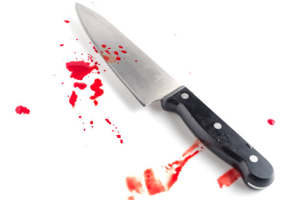 istock Bloody kitchen knife, and blood spots on the white background 1143258475