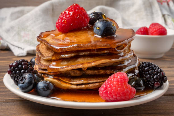 istock Pancakes with berries and honey. Soft focus 1143258618