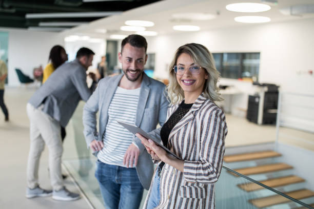 istock Two business people talking in a lobby 1143258703