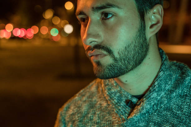 istock Cool young man crossing the street 1143258931
