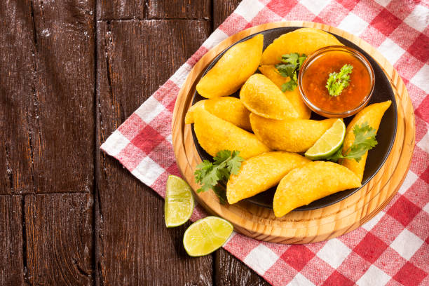 istock Colombian empanada with spicy sauce. Top view 1143259838