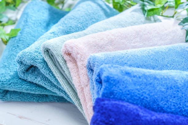 istock Stack of clean towels on wooden background 1143260078