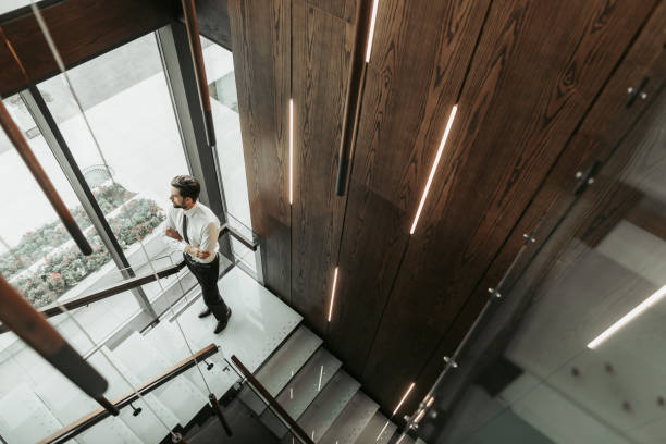 istock Orderly businessman watching at street during break 1143262463