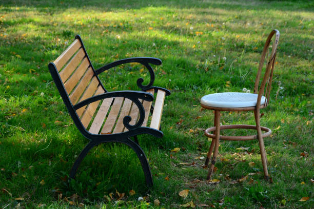Closeup two empty white chairs made of stainless steel with grid pattern, silence concept