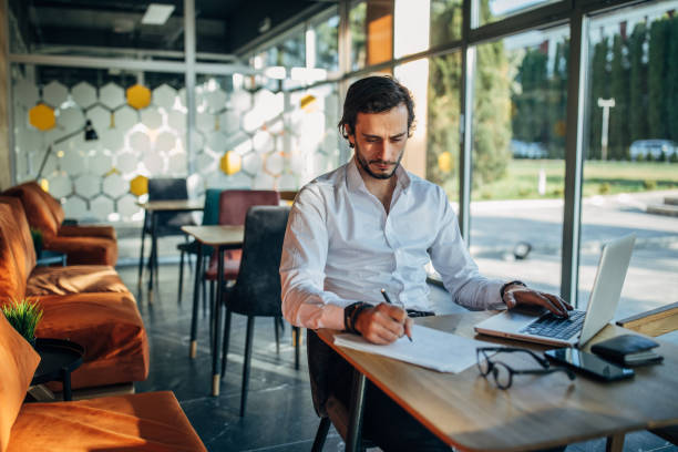 istock Businessman working in cafe 1143263838