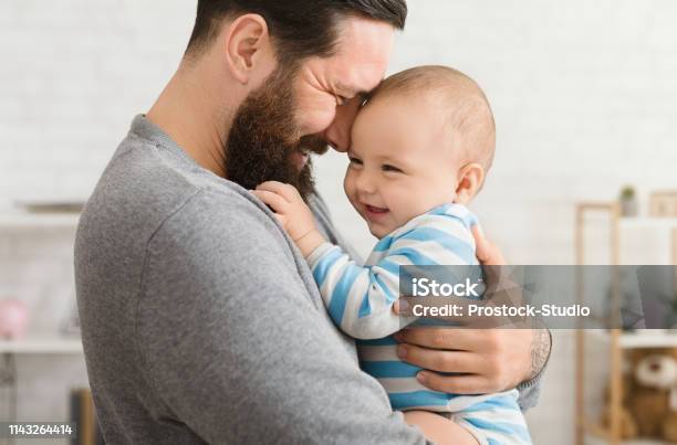 Loving Father Embracing His Cute Baby Son Stock Photo - Download Image Now - Father, Baby - Human Age, Parent