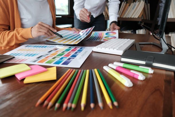 istock Graphic designer working on digital tablet. artist drawing on graphic tablet and Color swatch samples. 1143264543