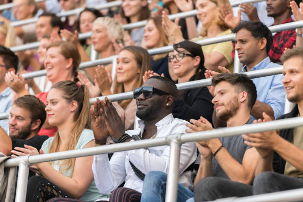 istock Group of spectators cheering in stadium 1143265461