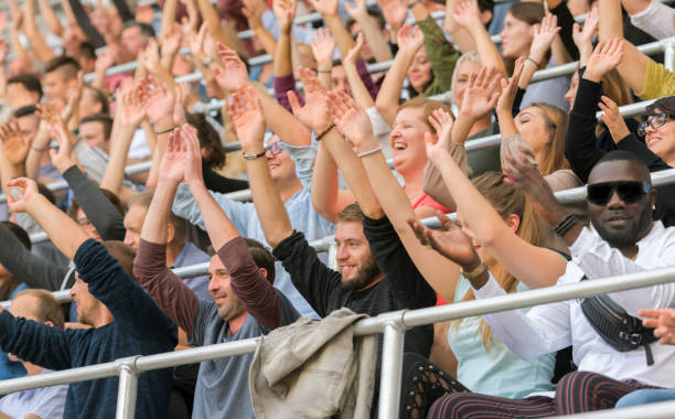 istock Group of spectators cheering in stadium 1143265468