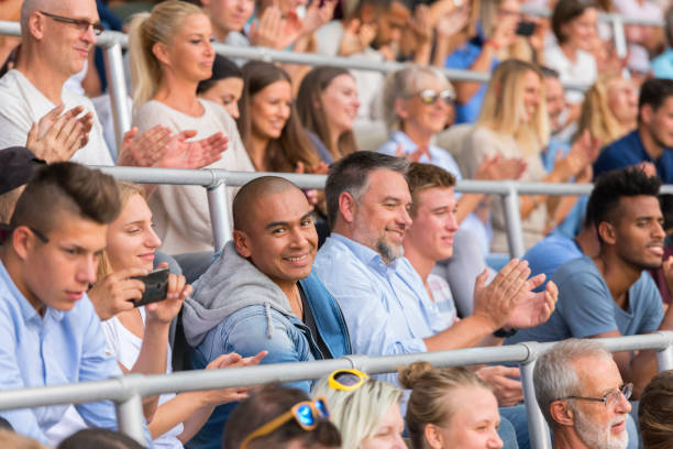 istock Group of spectators cheering in stadium 1143265474