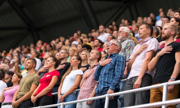 istock Spectators singing national anthem in stadium 1143265479