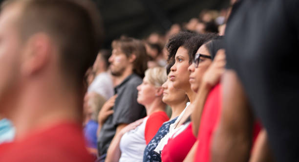 istock Spectators singing national anthem in stadium 1143265484
