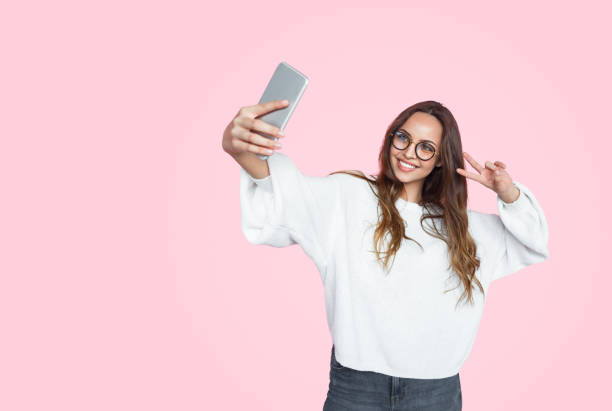 Stylish modern woman taking selfie