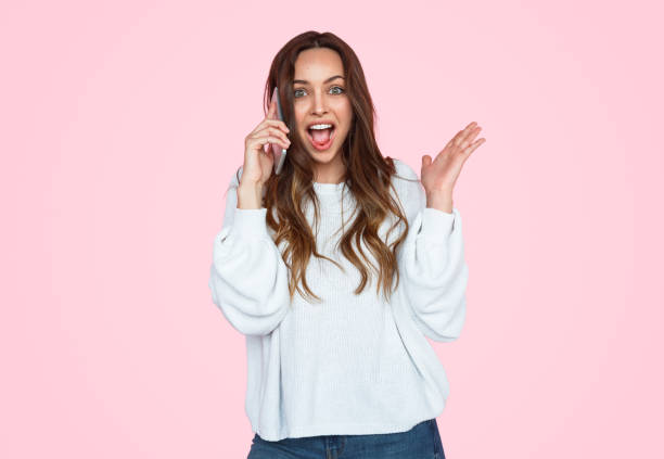 istock Excited female speaking on phone 1143266004