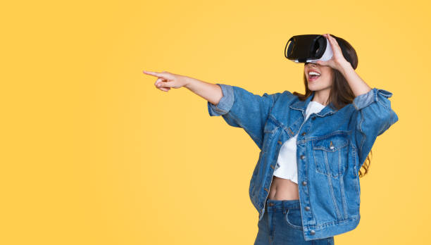 Excited woman using VR glasses