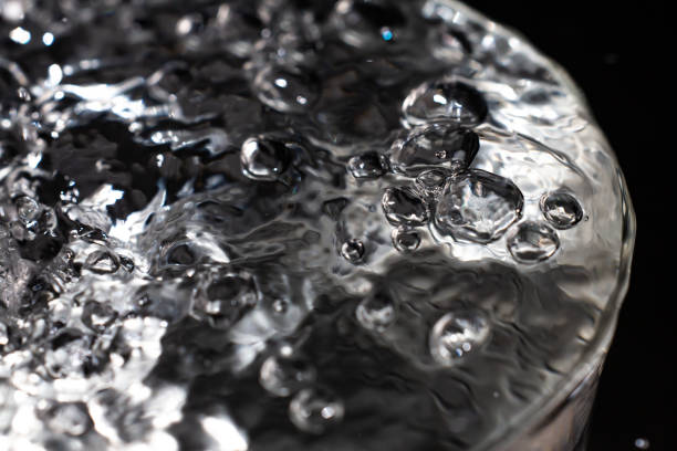 istock Clear water bubbles floating in transparent glass, Close up & Macro shot, Selective focus, Healthy Drink concept 1143268657