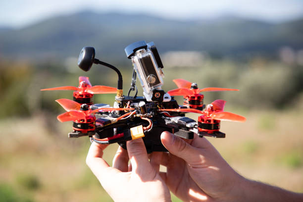istock Hands holding a fpv racing drone with action camera 1143268965
