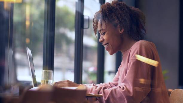 istock young African woman using laptop indoor 1143272568