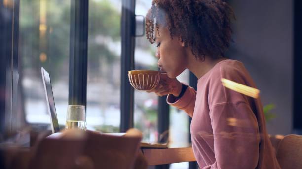 istock young African woman using laptop indoor 1143272571