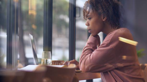 istock young African woman using laptop indoor 1143273146