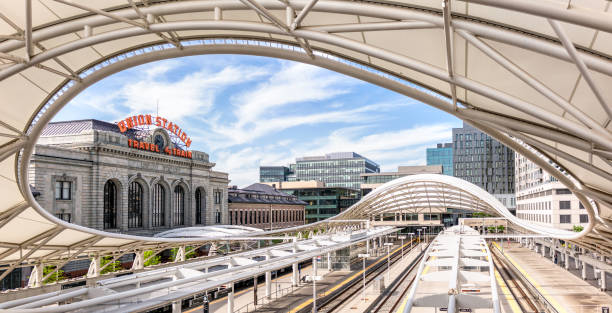 Denver Union Station Denver, USA - A panoramic image showing the tracks of Denver's Union Station partially covered by the canopy architecture. denver stock pictures, royalty-free photos & images