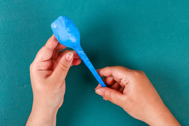 istock Diy cinco de mayo maracas from eggs, spoons and cereals on a green background. 1143274783