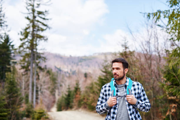 istock Mature man with backpack enjoying the view 1143275720