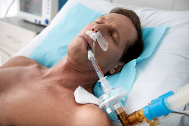 istock Patient on mechanical ventilation lying in intensive care ward 1143275759