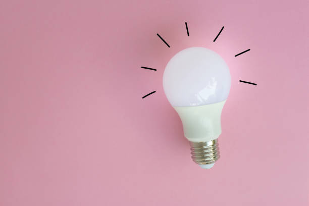 istock LED bulb with lighting and lighting line from drawing on the pink background for idea concept 1143276879