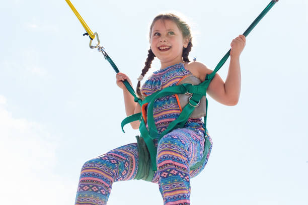 istock a young girl on the trampoline 1143277181