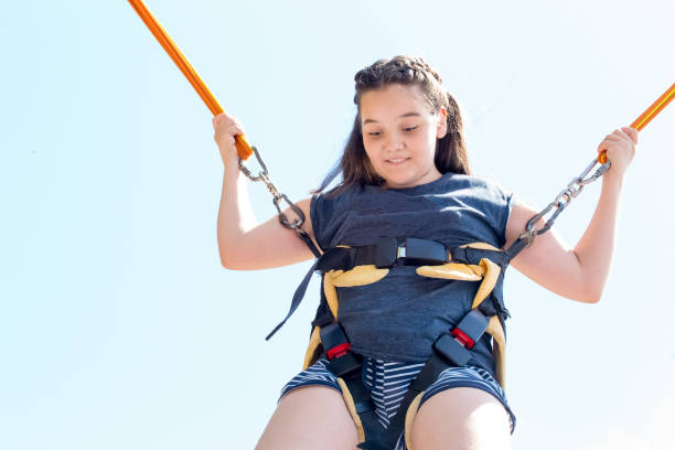 istock a young girl on the trampoline 1143277186