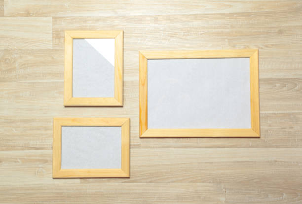 istock photo frames on the wooden wall 1143277309