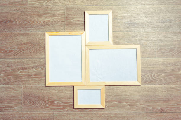 istock photo frames on the wooden wall 1143277325