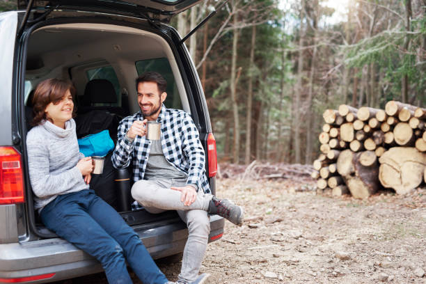 istock Cheerful boy and his dad drinking tea during spring hiking trip 1143277529