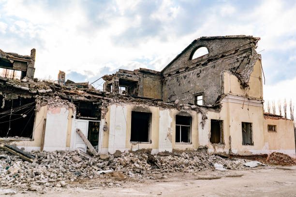 istock destroyed ruined house in the war and bricks laying around b 1143278408