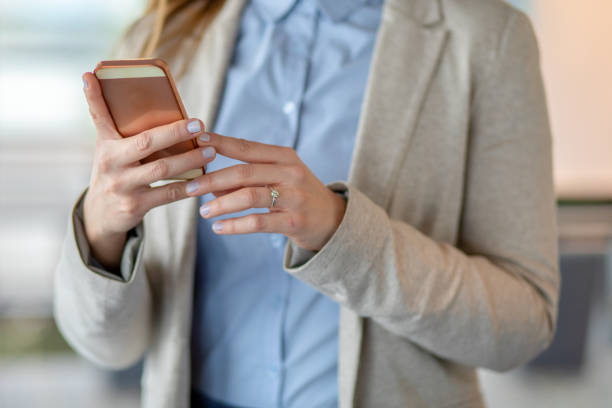 istock Beautiful women's hands typing message on the phone 1143278731