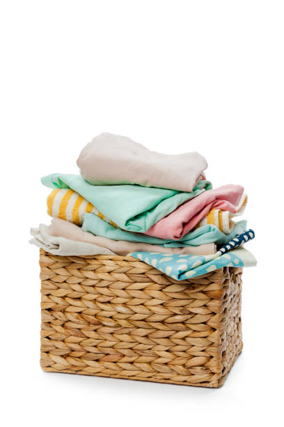 istock Clothes in a laundry wooden basket isolated on white background 1143279544
