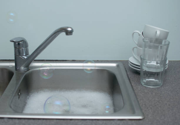 istock The soapy water sink is ready for do washing 1143280271