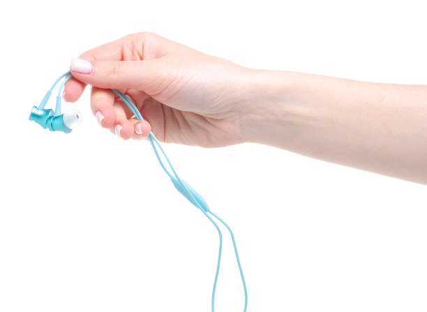 istock Blue headphones in hand 1143280387