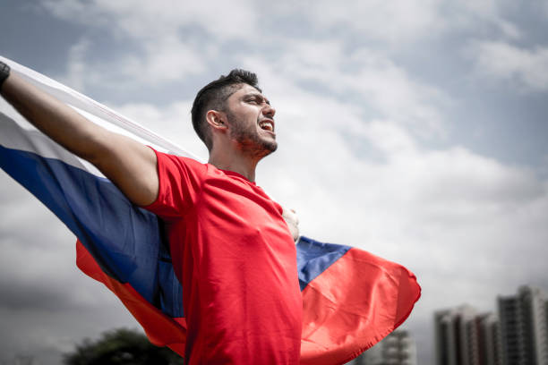 istock Male fan holding russian flag 1143281947